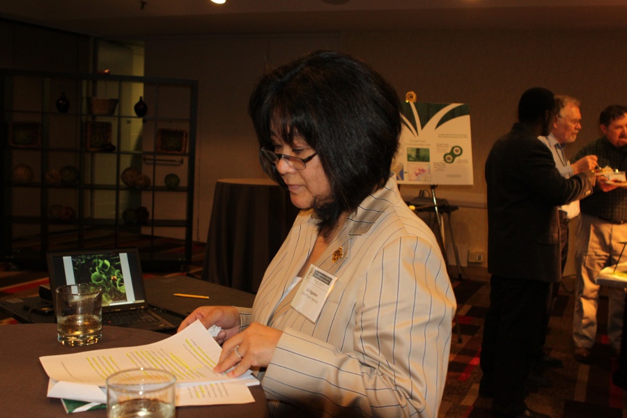 Liz Agpaoa, USFS Regional Forester reviews her notes before speaking (Photo by Lark Hayes)